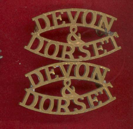 DEVON & DORSET brass shoulder titles