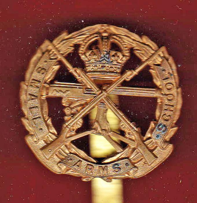 Small Arms School cap badge