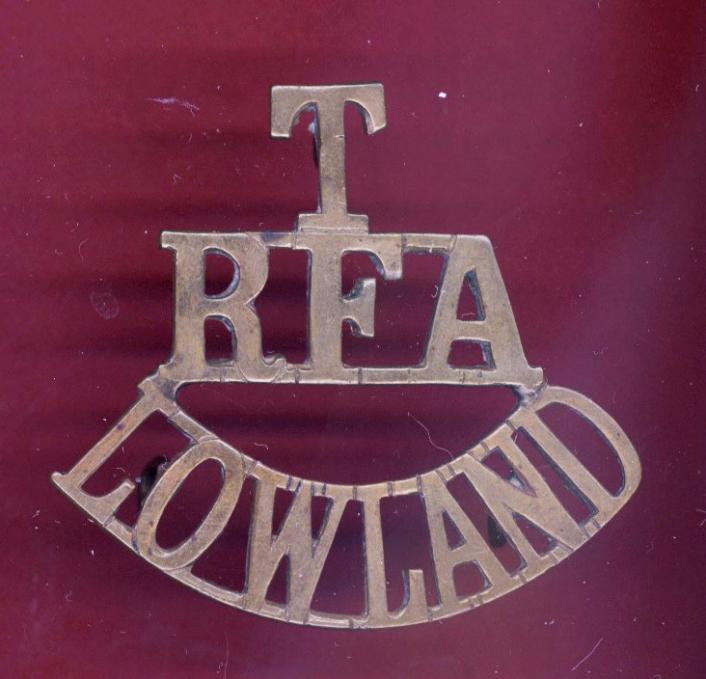 T / RFA / LOWLAND  WW1 white metal shoulder title