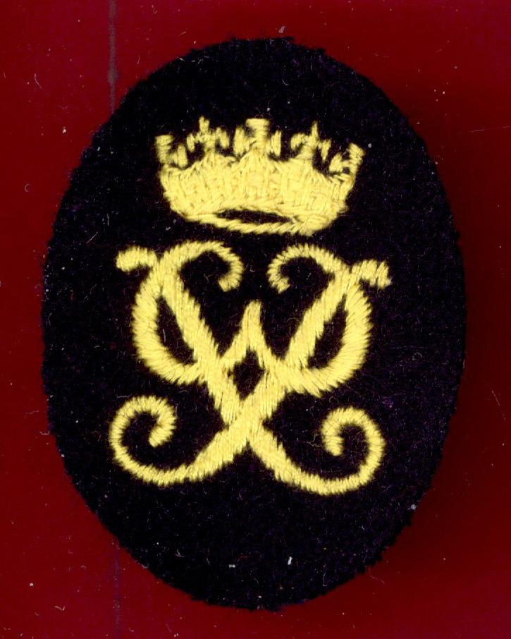 Queen’s Royal Irish Hussars Trooper’s cloth D.O.E. badge.